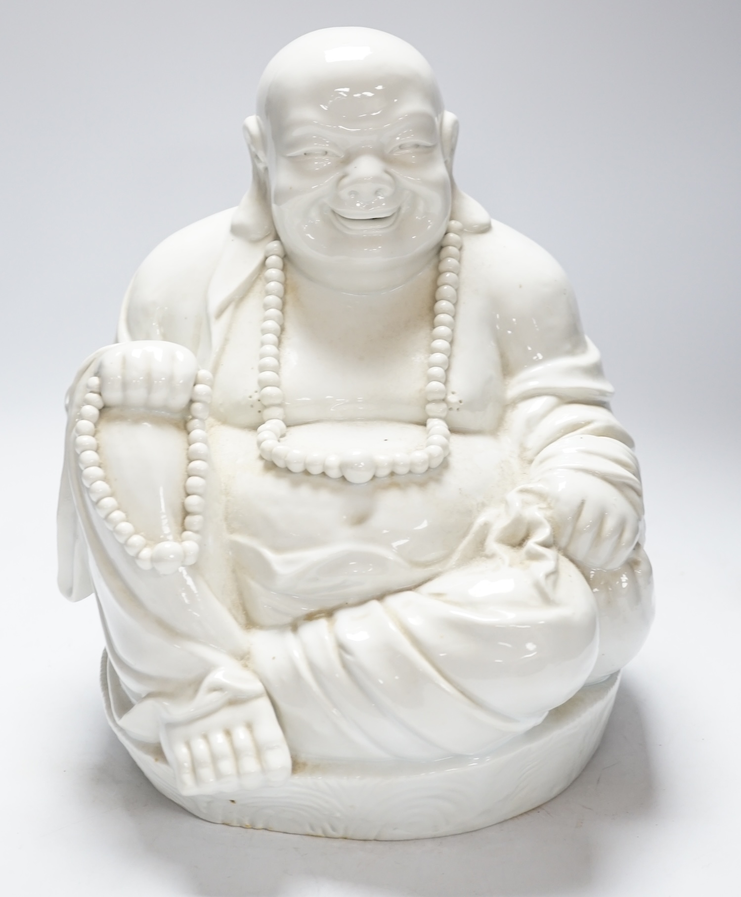 A Chinese Blanc de chine figure of Budai, 32cm high
